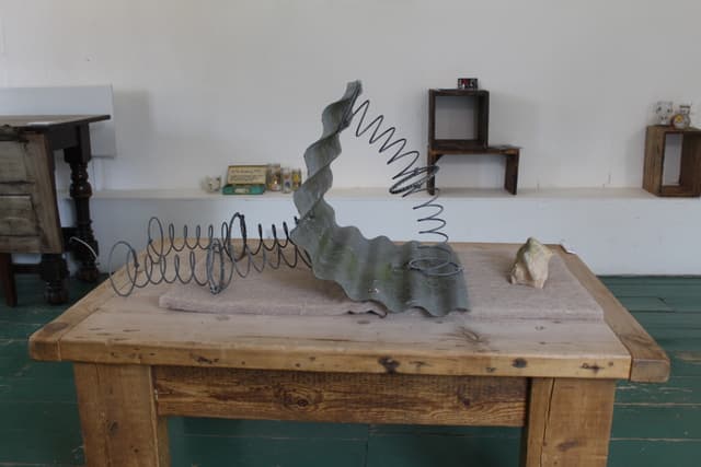 a scultpure made of corrogated steel and springs